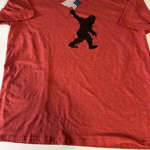 Red Graphic Tee‎ with Flag Design and Big Foot